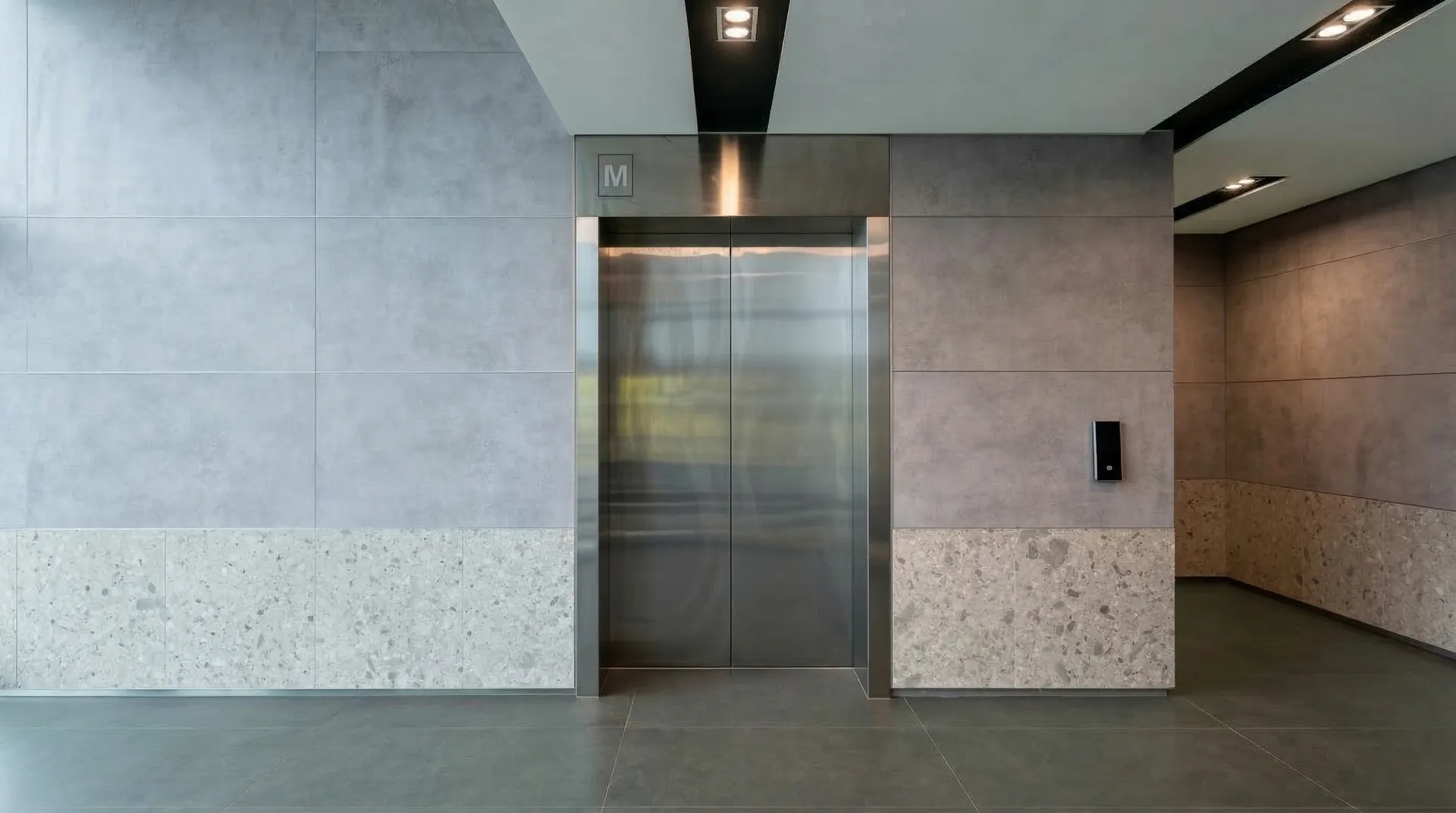 Lift lobby before wrap — stainless steel doors