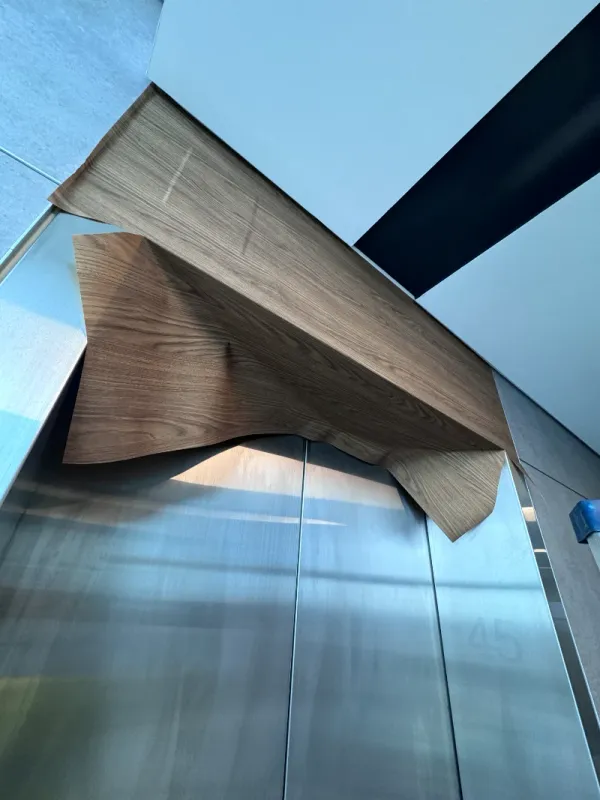 Installing vinyl wrap on lift header panel, BHP Perth