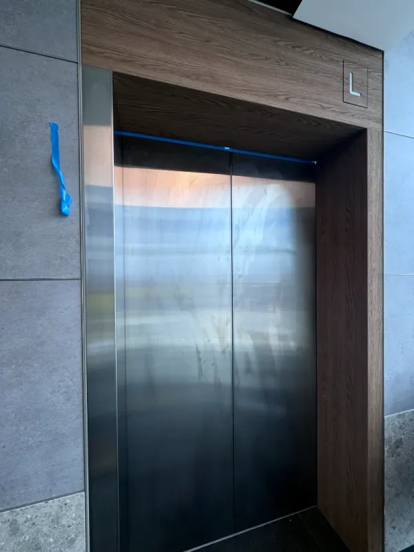 Side wall vinyl wrap in progress, BHP Perth Building