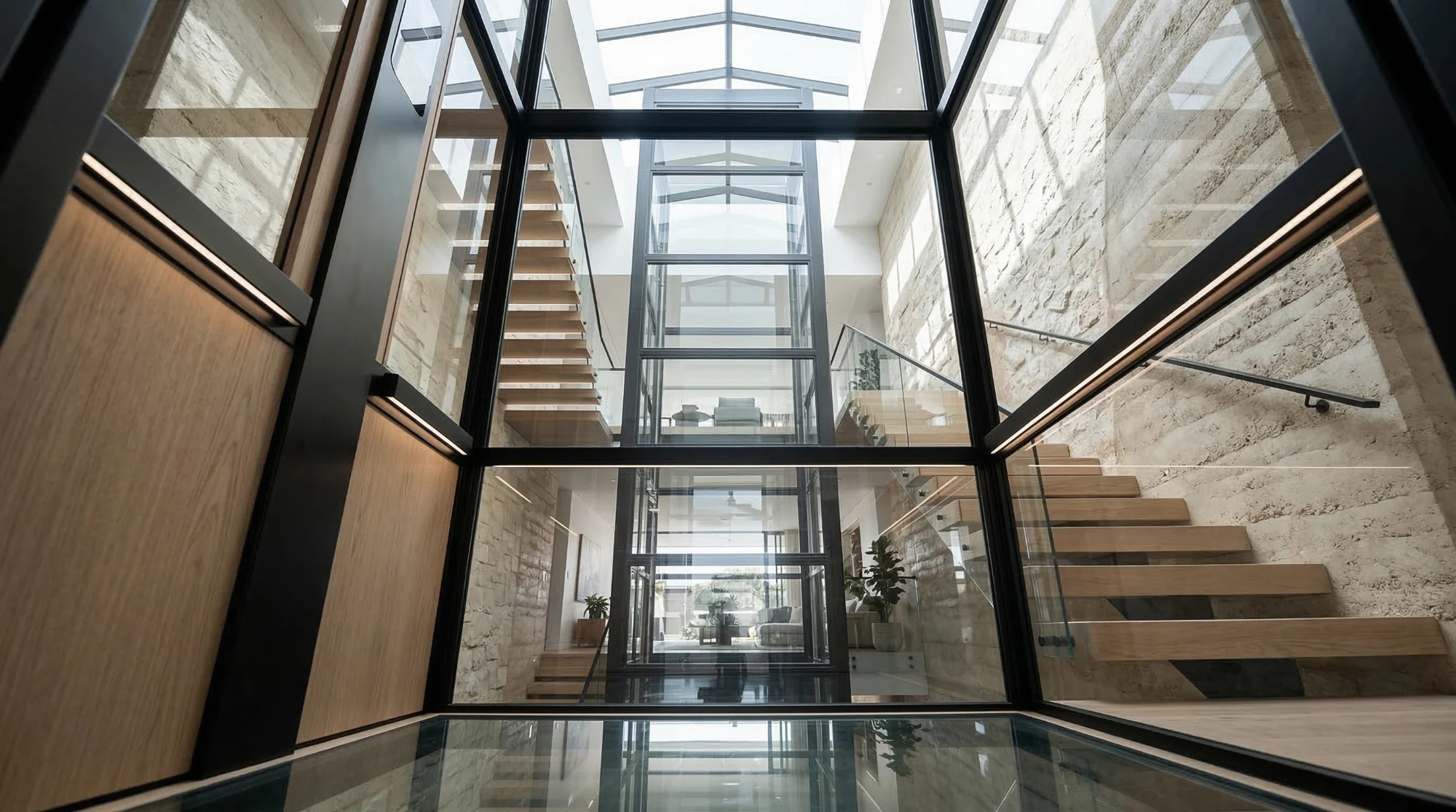 Glass elevator shaft in a modern atrium