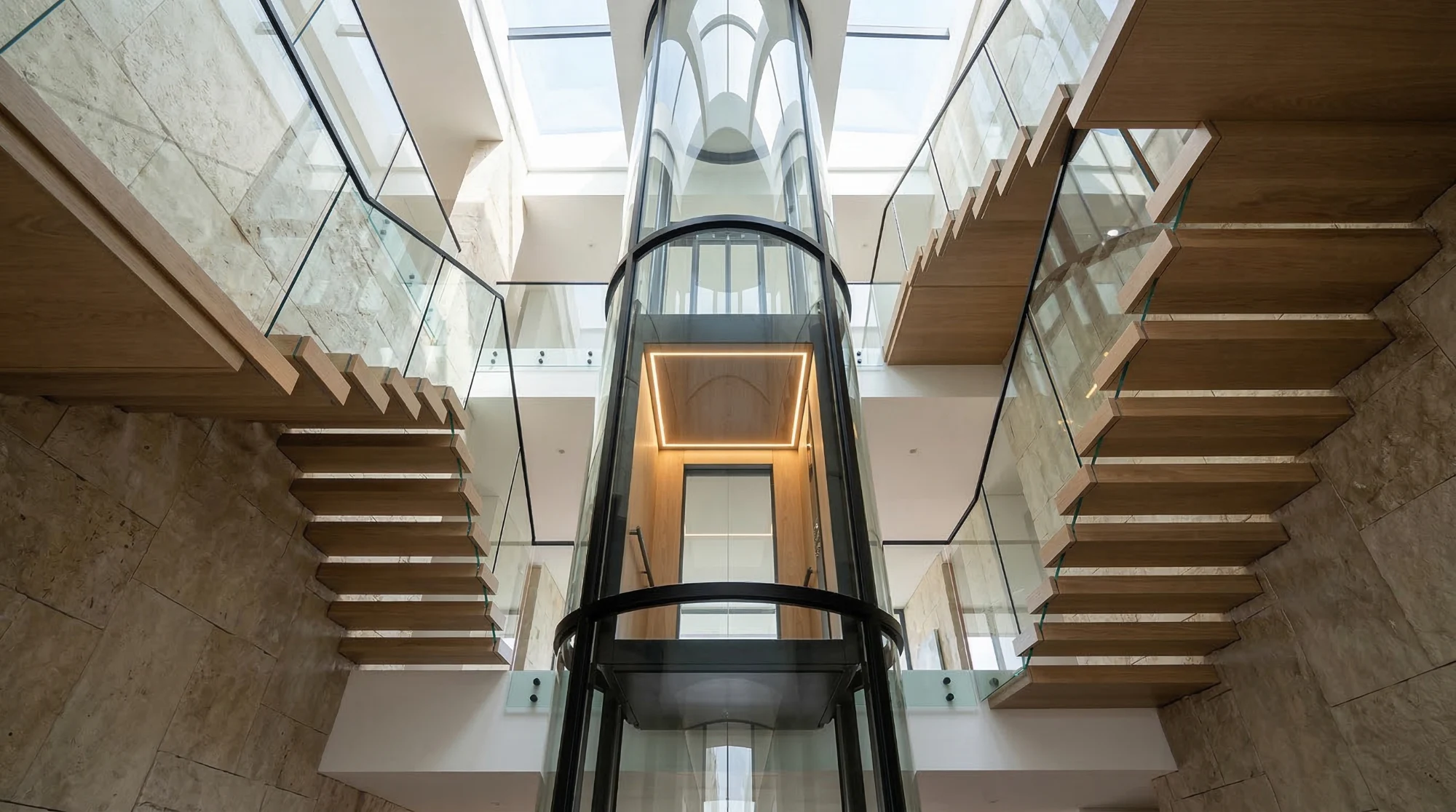 Glass panoramic elevator in a modern atrium